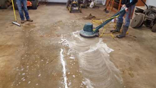 Etch the surface of a concrete floor